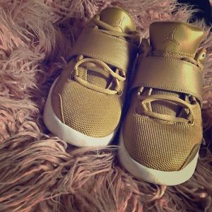 Gold Jordan sneakers